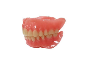 The individual parts of the printed denture are bonded together with a light cure procedure.