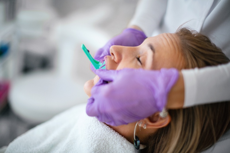 Dentist taking patients dental impression